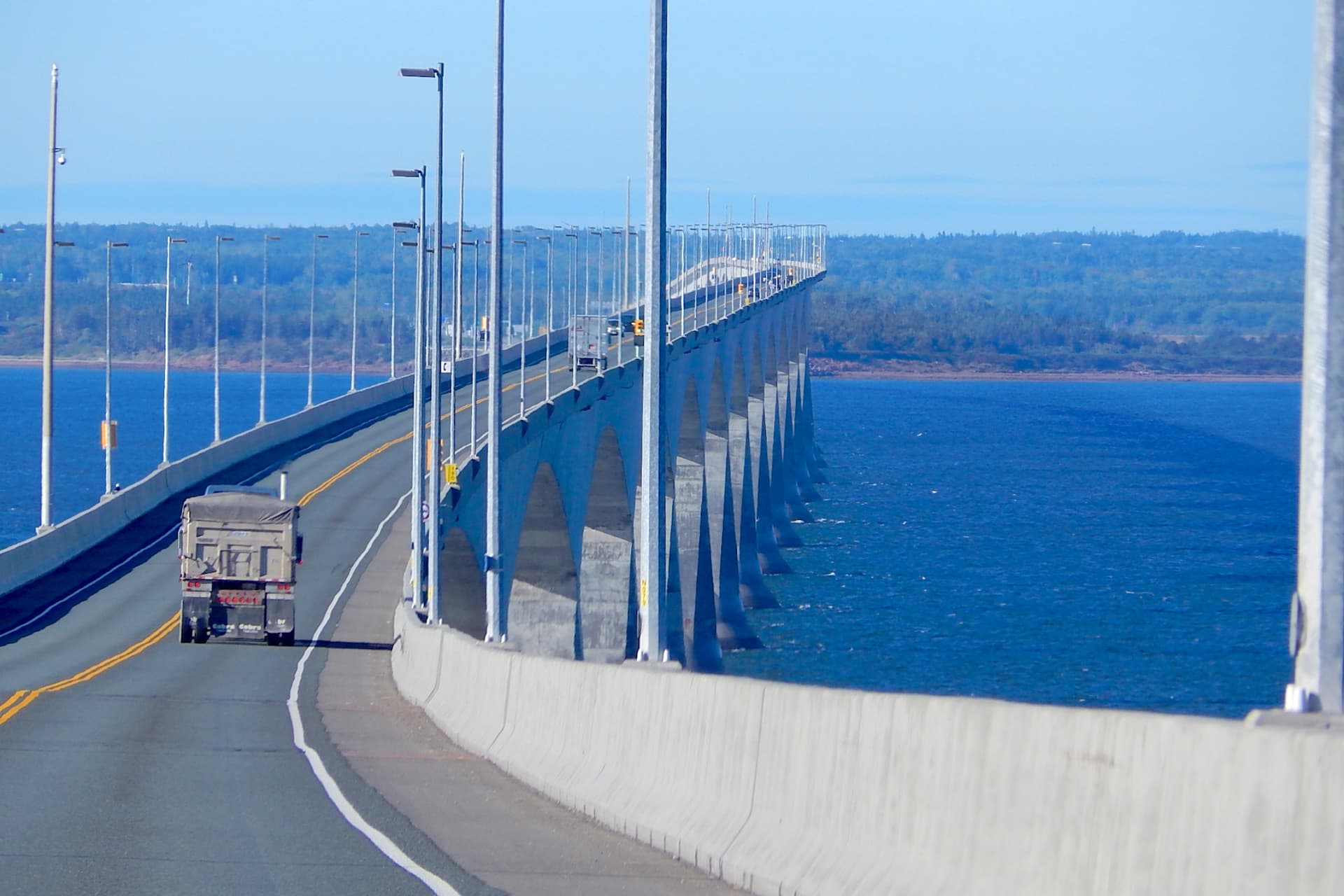 https://images.dailyhive.com/20250327134803/confederation-bridge-pei-prince-edward-island-f5.jpg