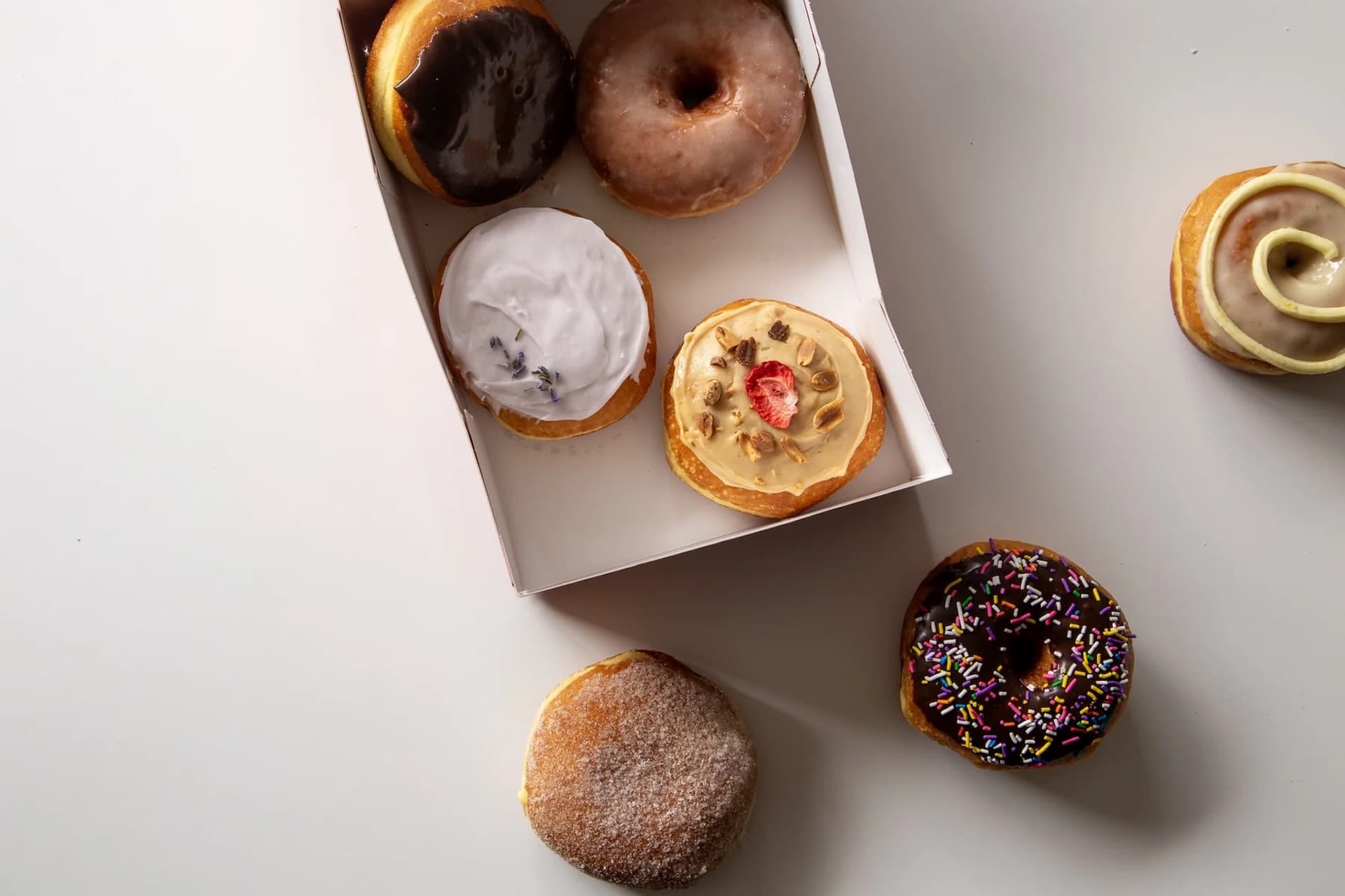 https://images.dailyhive.com/20250428145116/JJ-Neates-Donuts-Spread_2048x2048-copy.jpg