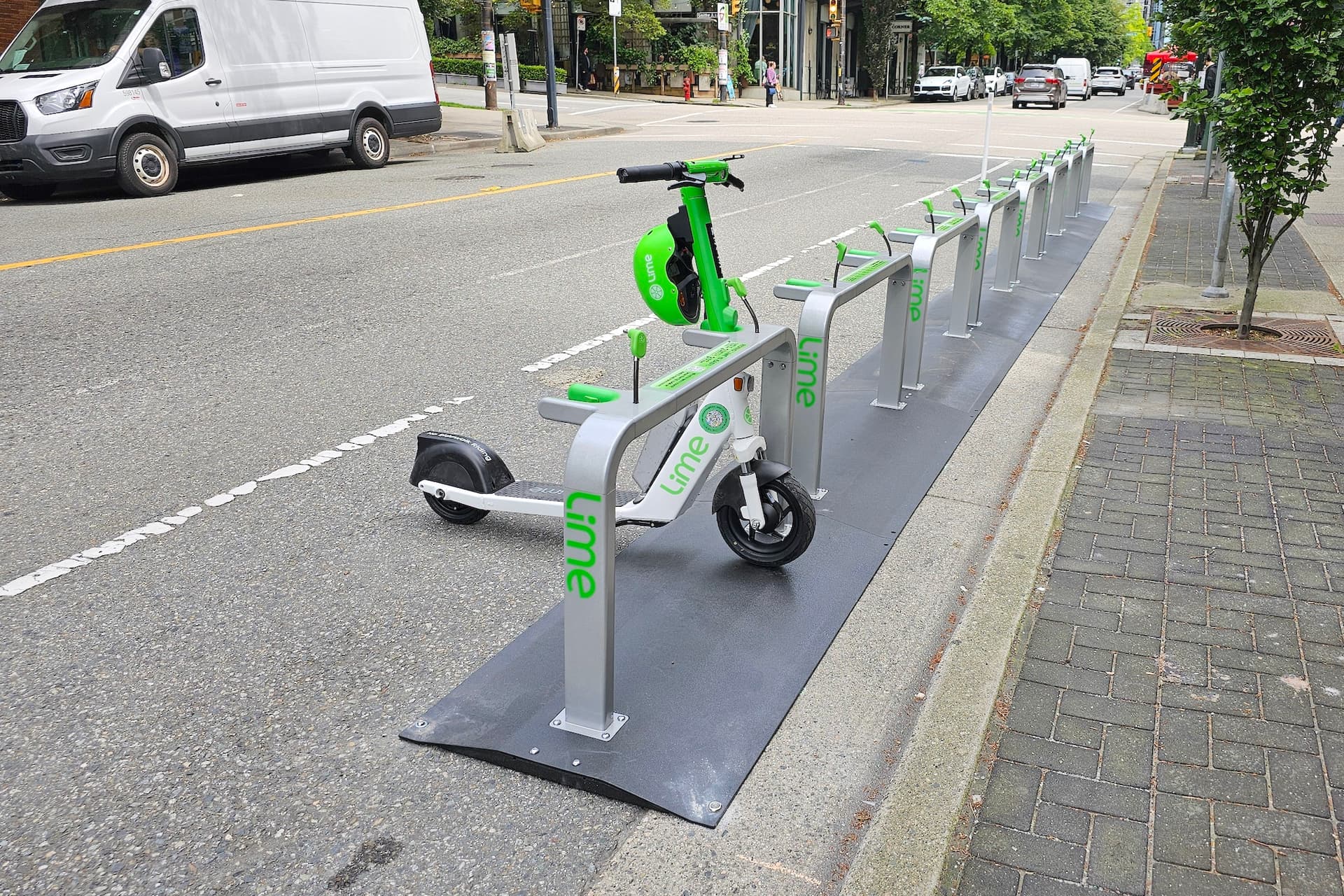 https://images.dailyhive.com/20250611160210/lime-e-scooter-share-station-downtown-vancouver-2.jpg