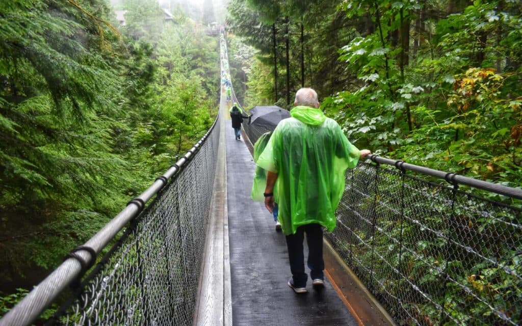 https://www.vancouverplanner.com/wp-content/uploads/2024/05/capilano-suspension-bridge-rainy-crossing-1024x640.jpeg